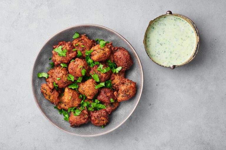 Veg,Pakora,In,Gray,Bowl,On,Concrete,Table,Top.,Pakoda